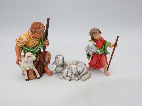 Shepherd boy with lamb, sheep with lamb + shepherd kneeling