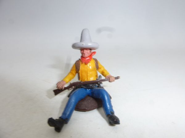 Britains Swoppets Cowboy sitting on tree trunk, grey Stetson