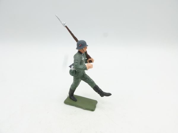 Starlux Soldier goose-stepping, rifle shouldered