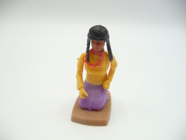 Plasty Indian woman kneeling