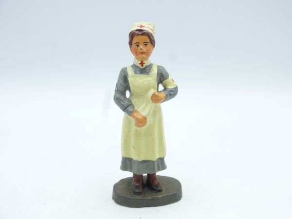 Nurse standing with cloth (probably Elastolin)
