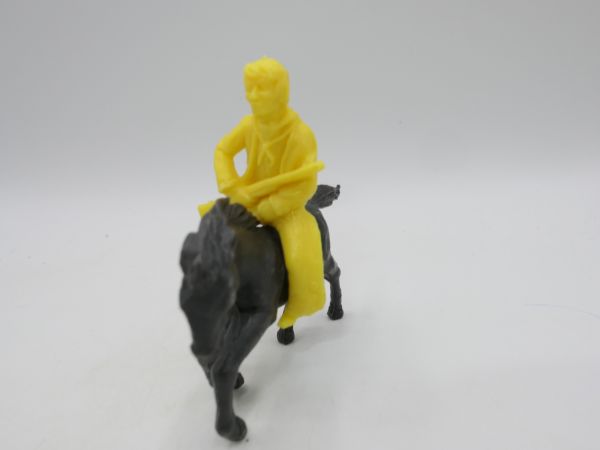Heinerle Manurba Cowboy riding, rifle in front of body, yellow