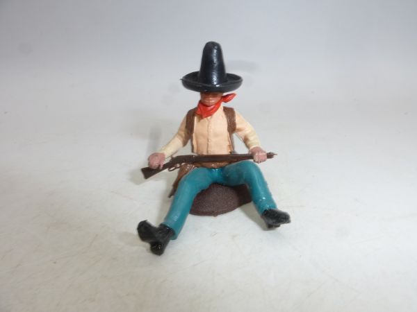 Britains Swoppets Cowboy sitting by the tree trunk, black Stetson