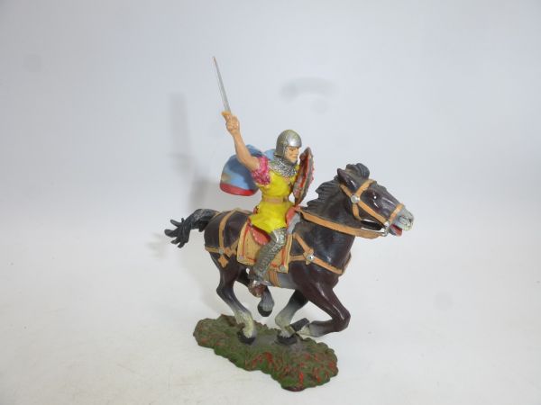 Norman on horseback with cape, lunging sword from above
