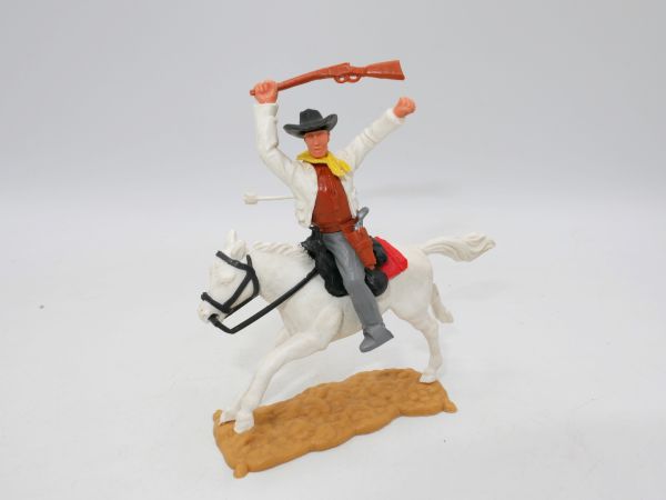 Timpo Toys Cowboy 3rd version riding, firing rifle, hit by arrow