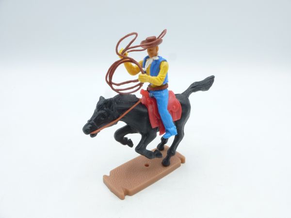 Plasty Cowboy riding with lasso