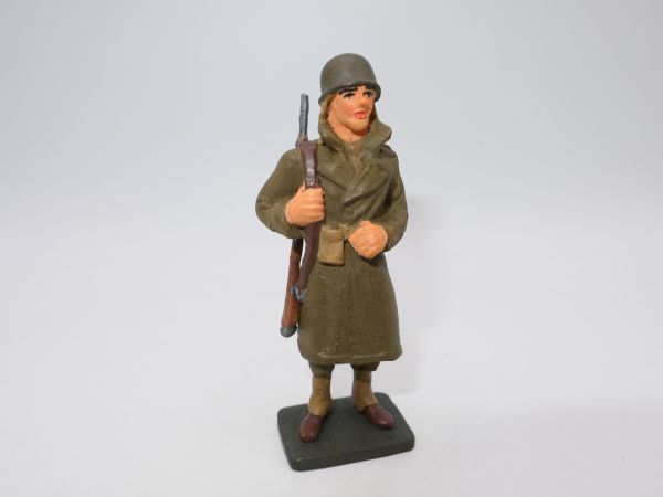 WW soldier with coat, presumably made of resin, marked with "GK