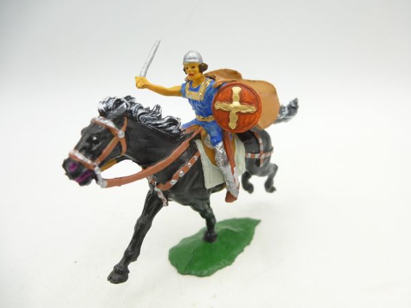 Norman with sword, shield + cape on horseback