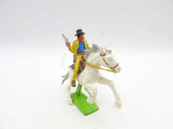 Britains Deetail Cowboy riding, bandit with pistol + money bag