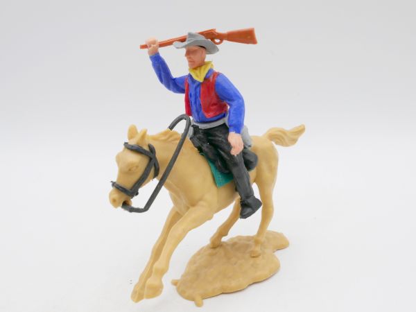 Timpo Toys Cowboy reitend, mit Gewehr schlagend