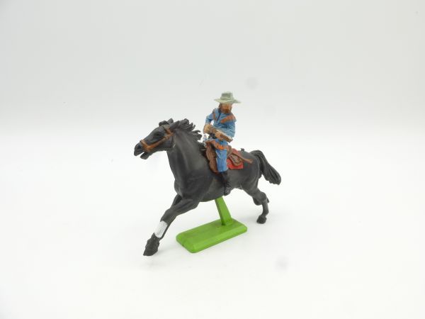 Britains Deetail Cowboy riding, rifle in front of body