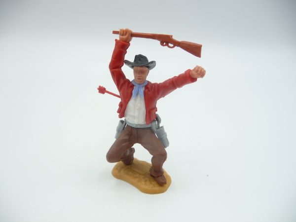 Timpo Toys Cowboy 2. Version hockend, von Pfeil getroffen