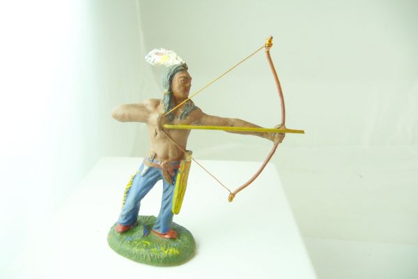 Plastinol Indian standing with bow and feather of composition