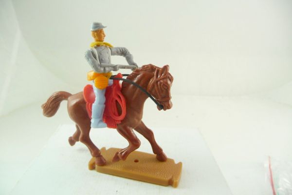 Plasty Confederate Army soldier riding with rifle in front of the body