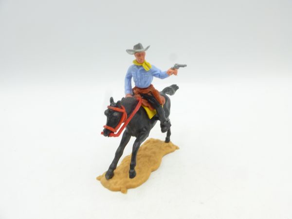Timpo Toys Cowboy mounted shooting with pistol, nice colour combination