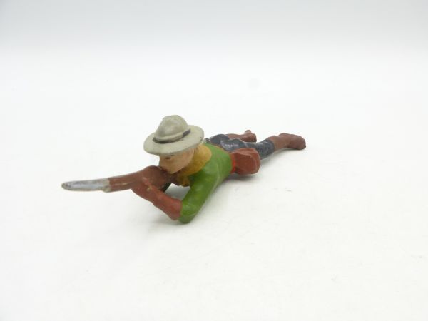 Cowboy lying shooting rifle, light green jacket