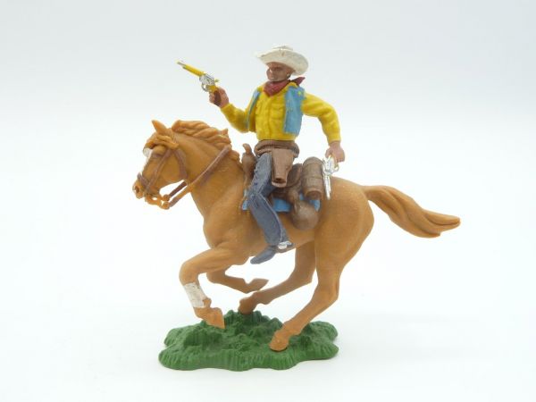 Britains Swoppets Cowboy riding, firing with 2 pistols