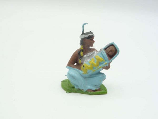 Britains Swoppets Indian woman sitting with baby, yellow wrapping
