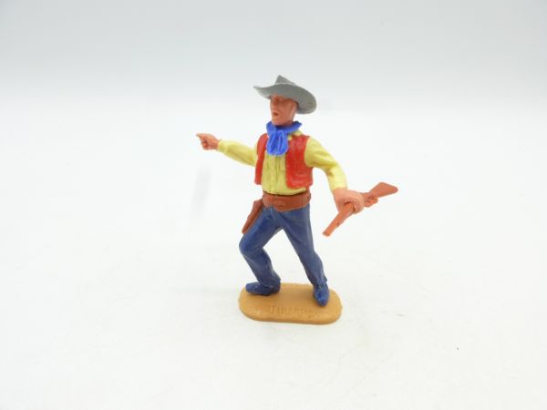 Timpo Toys Cowboy stehend mit Gewehr, seitlich zeigend