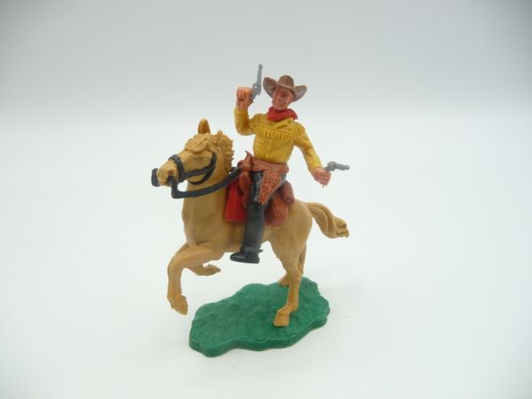 Timpo Toys Cowboy 2nd version riding, firing wild with 2 pistols
