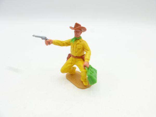 Timpo Toys Cowboy 2. Version hockend mit Pistole + Geldtasche