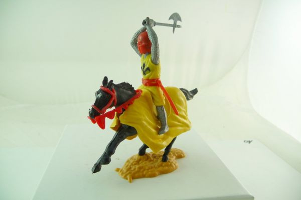 Timpo Toys Medieval knight riding yellow, battleaxe ambidextrous over head