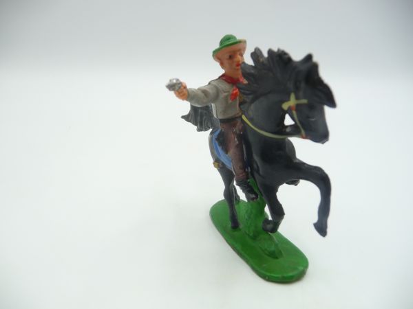 Cowboy riding, firing pistol - rare colour