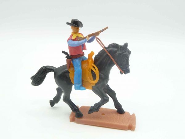 Plasty Cowboy riding, firing rifle