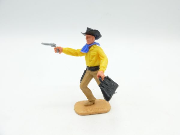 Timpo Toys Cowboy laufend mit Pistole + Geldtasche