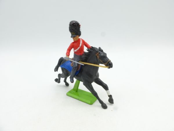 Britains Deetail Waterloo soldier on horseback, sabre at side, red uniform