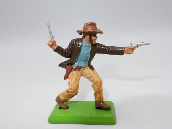 Britains Deetail Cowboy leading with 2 pistols, brown jacket