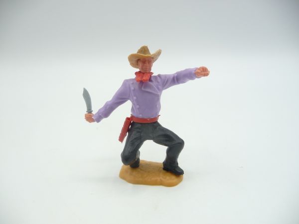 Timpo Toys Cowboy 2. Version hockend mit Messer - schönes fliederfarbenes Oberteil