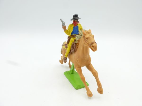 Britains Deetail Cowboy riding / Bandit with pistol + money bag