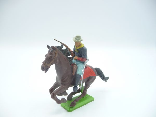 Britains Deetail US cavalryman riding, firing rifle from the hip