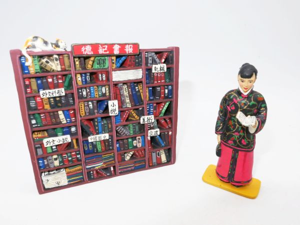 King & Country Chinese lady reading book with library as background