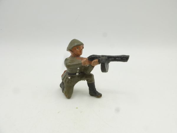 Soldier kneeling, shooting with MG - rare material