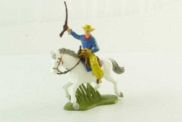 Britains Swoppets Cowboy riding, holding up rifle (made in HK)
