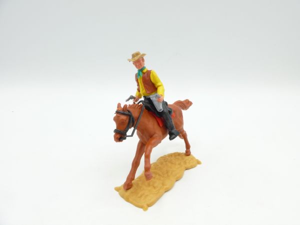 Timpo Toys Cowboy 3. Version (großer Kopf) reitend, 2 Pistolen schießend