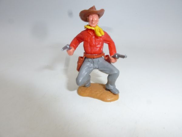 Timpo Toys Cowboy 2. Version hockend, 2 Pistolen schießend