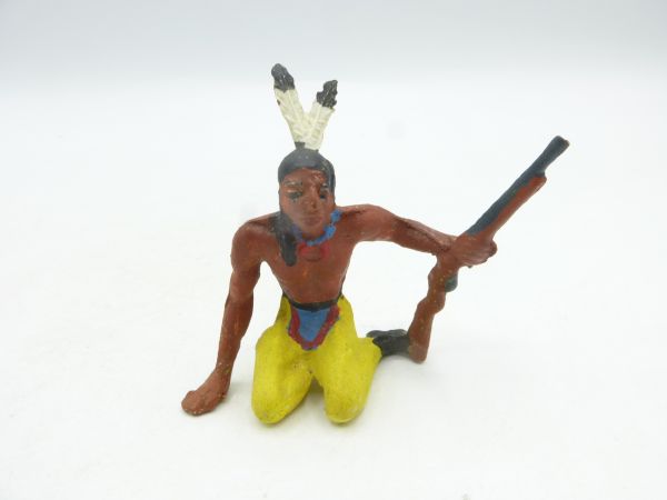 Merten Indian sitting, rifle sidewards, trousers yellow