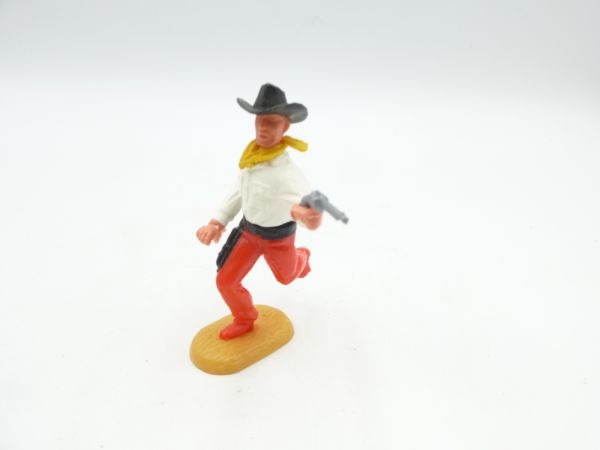 Timpo Toys Cowboy running, firing pistol - legs translucent red