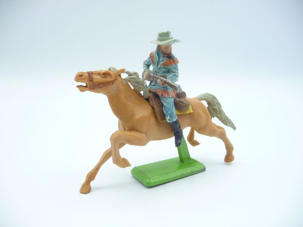 Britains Deetail Cowboy riding, rifle in front of the body