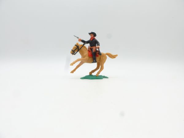 Timpo Toys Cowboy 2. Version reitend mit Pistole + Geldtasche (schwarz)