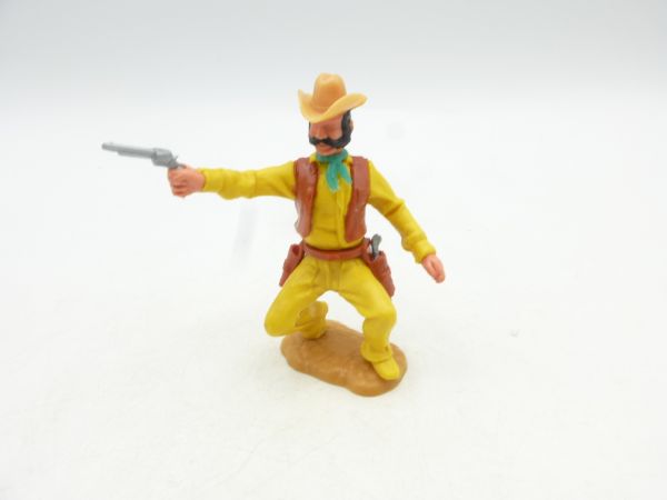 Timpo Toys Cowboy 3. Version hockend, Pistole schießend