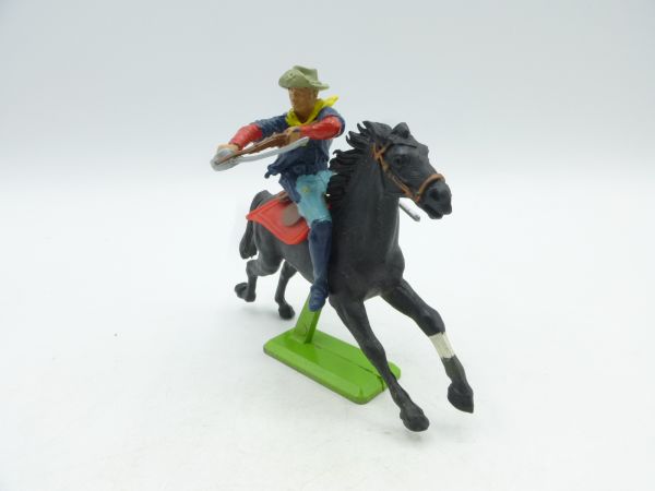 Britains Deetail 7th cavalry soldier riding, firing rifle over sabre