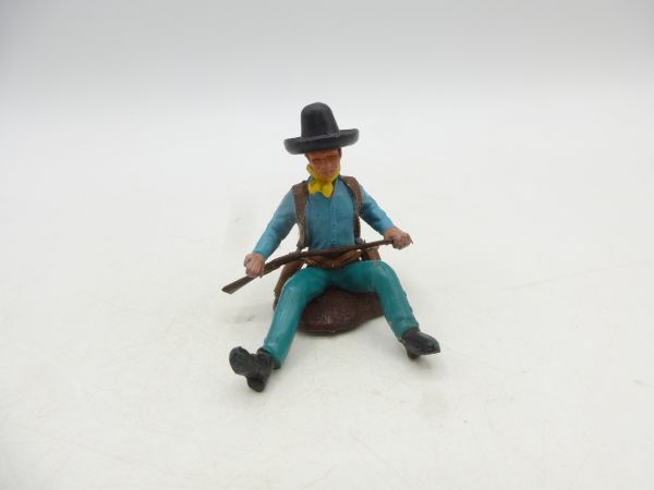 Britains Swoppets Cowboy sitting on a tree trunk - great hat