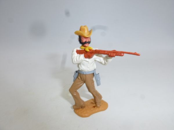 Timpo Toys Cowboy 3rd version (big head) standing, shooting rifle