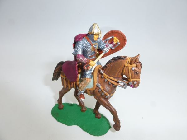 Norman riding with shield, mace + cape