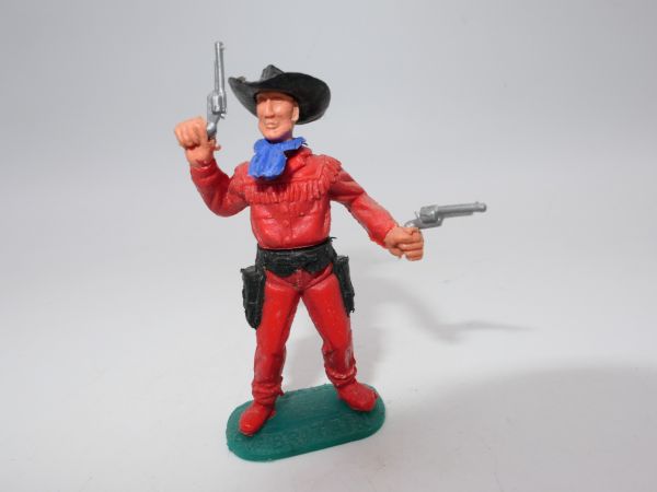Timpo Toys Cowboy version standing, firing 2 pistols wildly, red legs