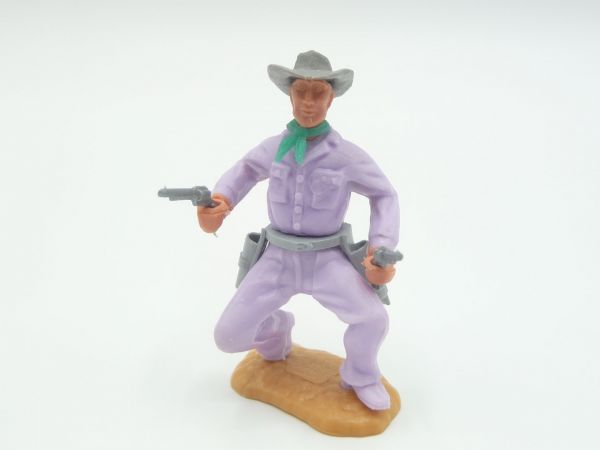 Timpo Toys Cowboy 2. Version hockend mit seltenem fliederfarbenen Unterteil